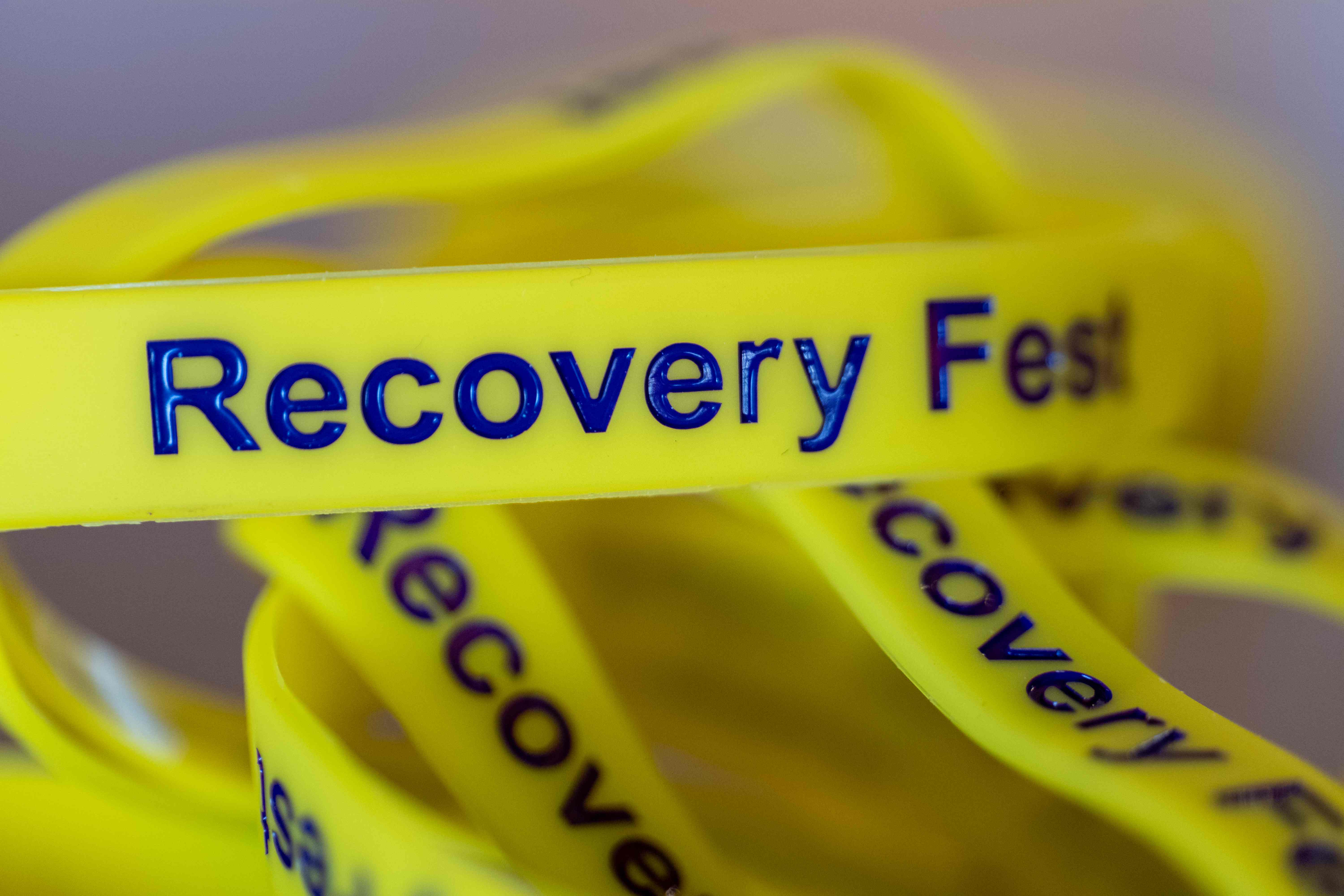 Family enjoying resources at Recovery Fest table