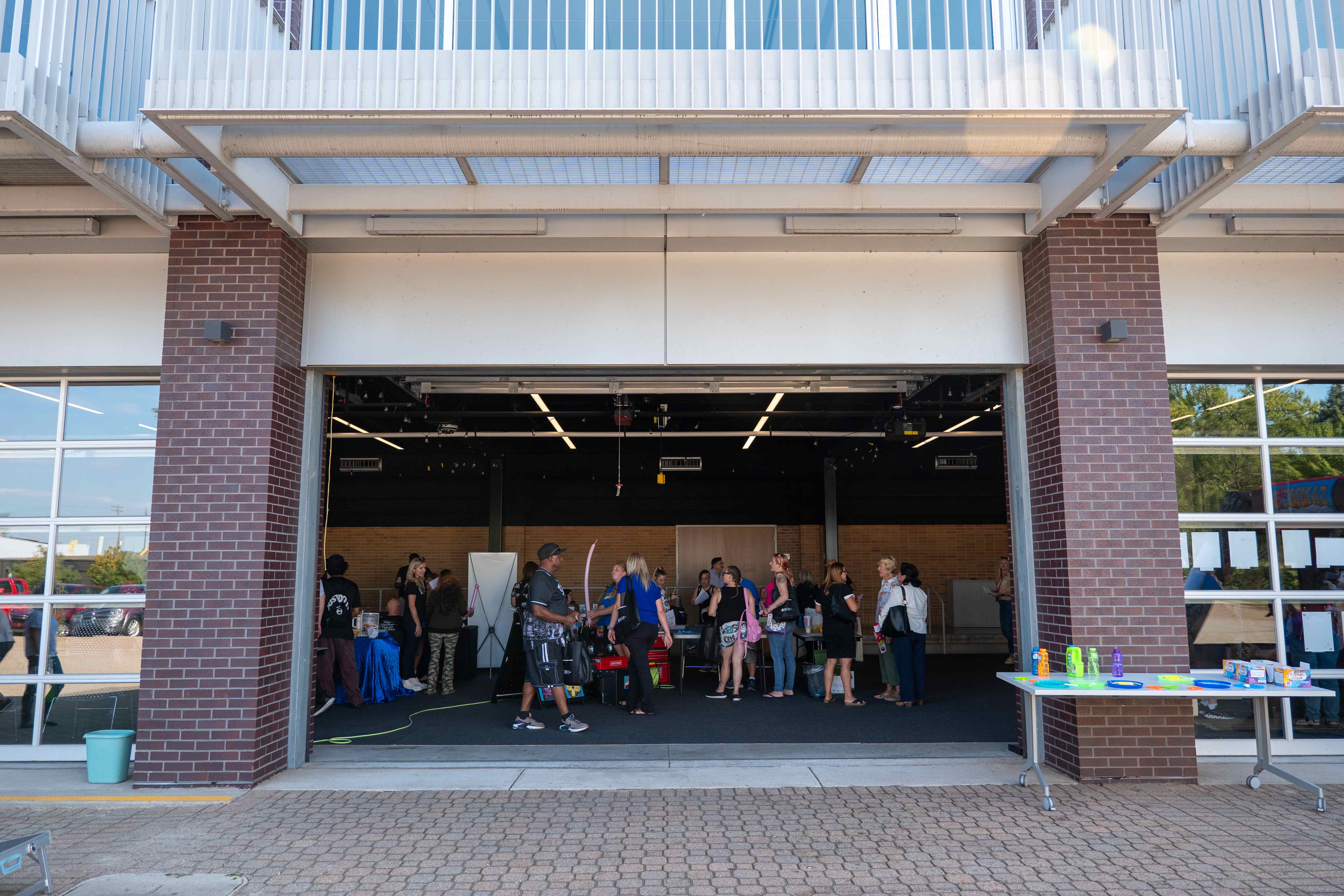Young attendee holding Recovery Fest 2024 t-shirt