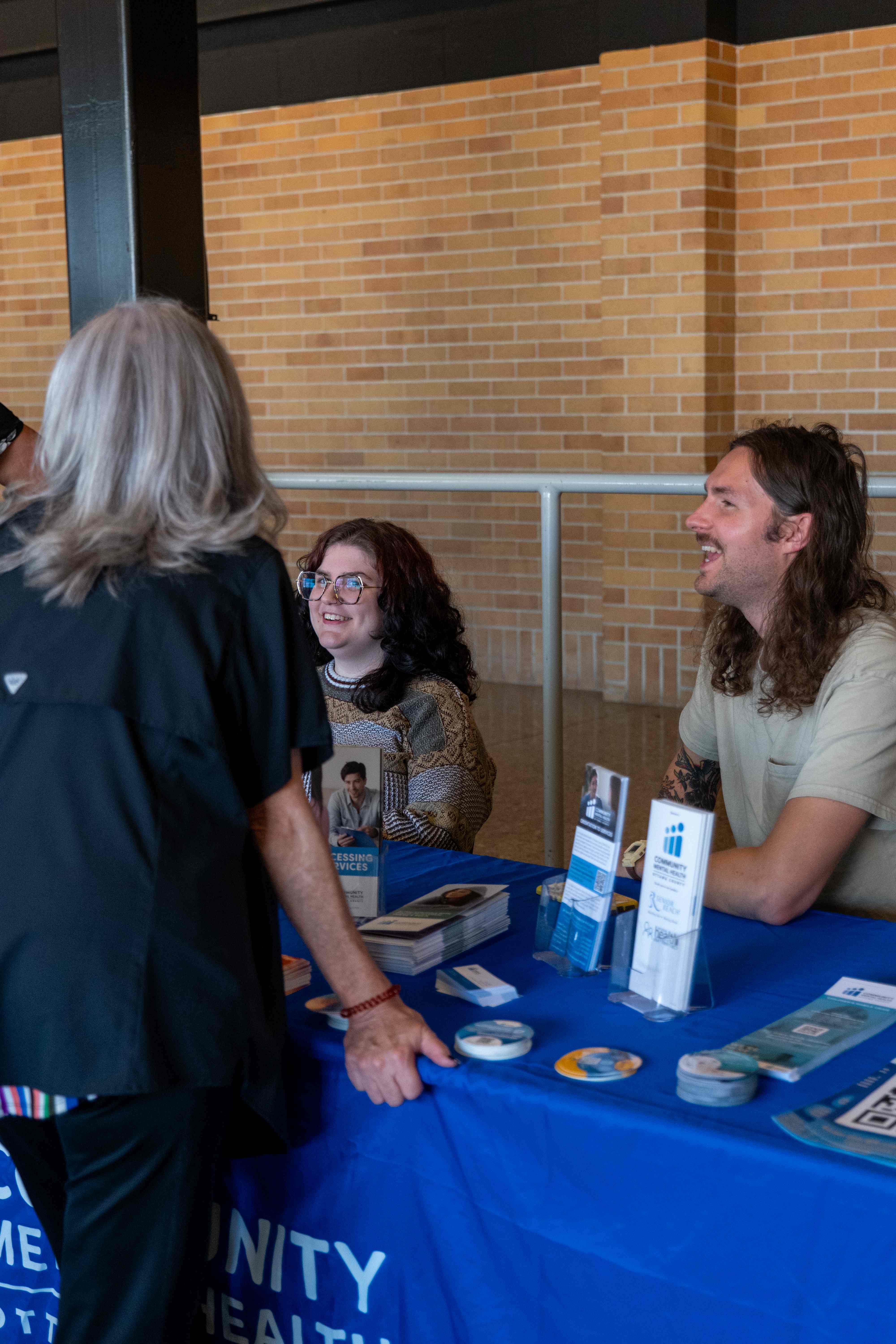 Recovery Fest volunteers with banner on building