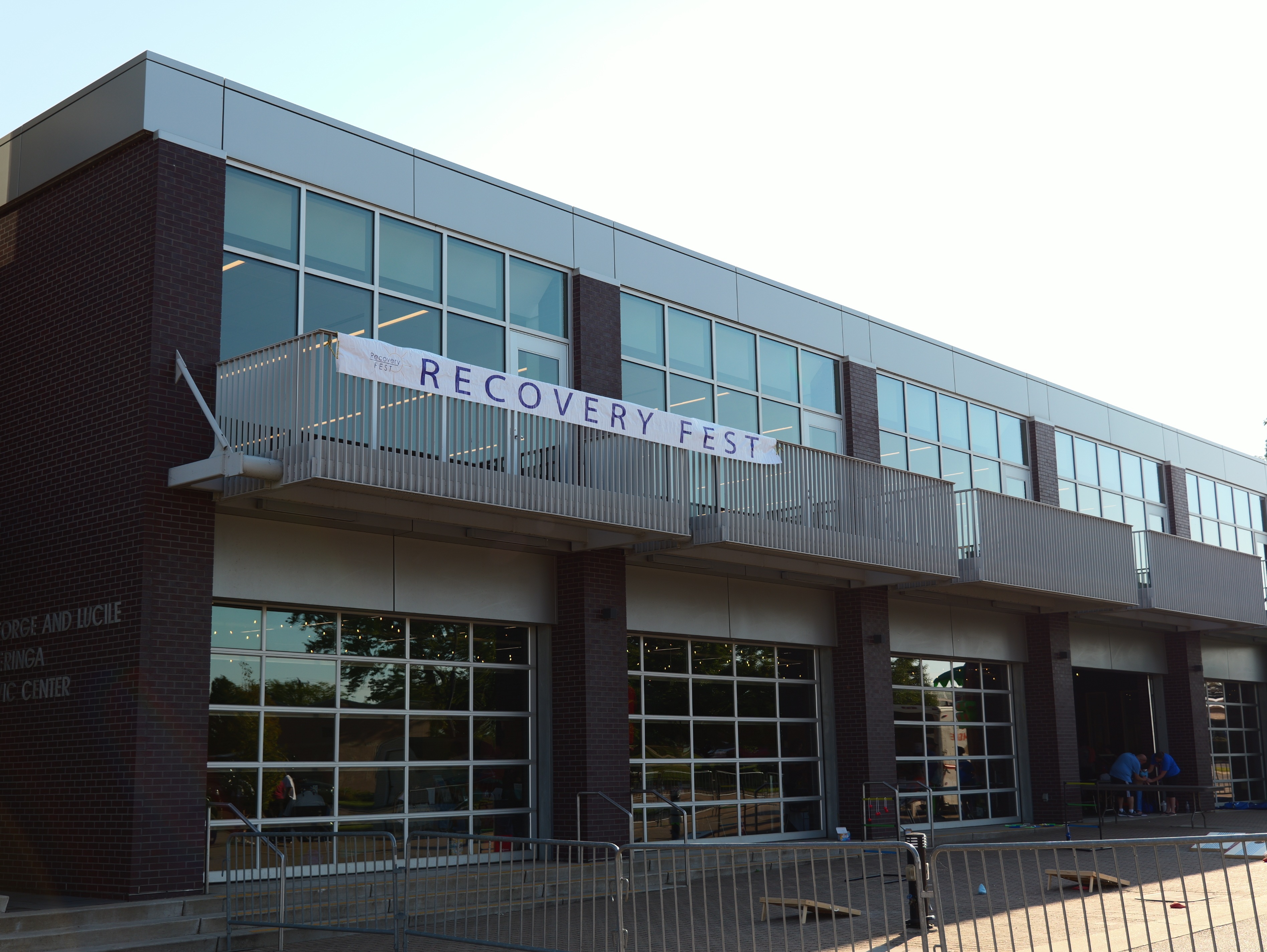 Indoor resource fair with attendees and volunteers