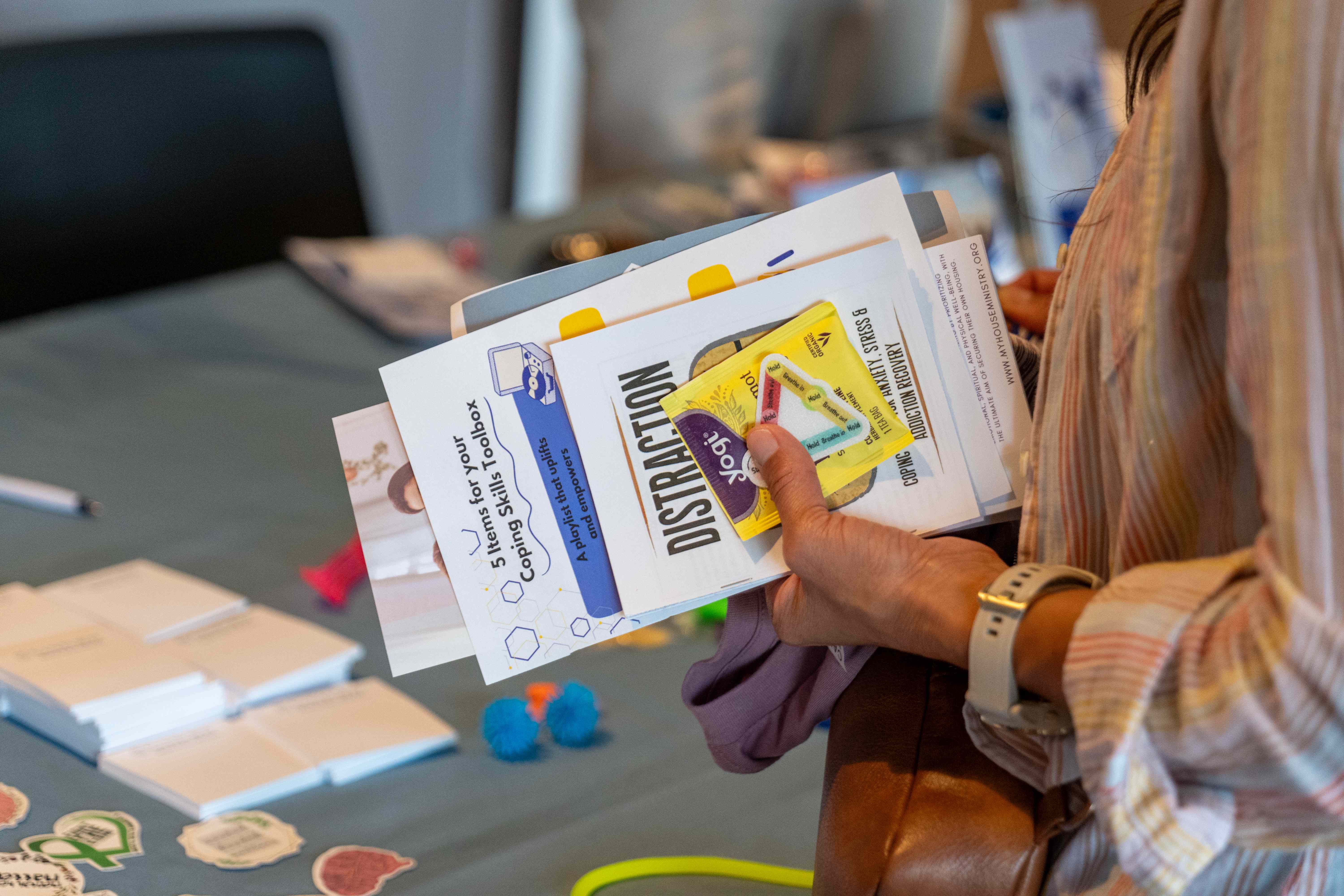 Attendee receiving Recovery Fest t-shirt