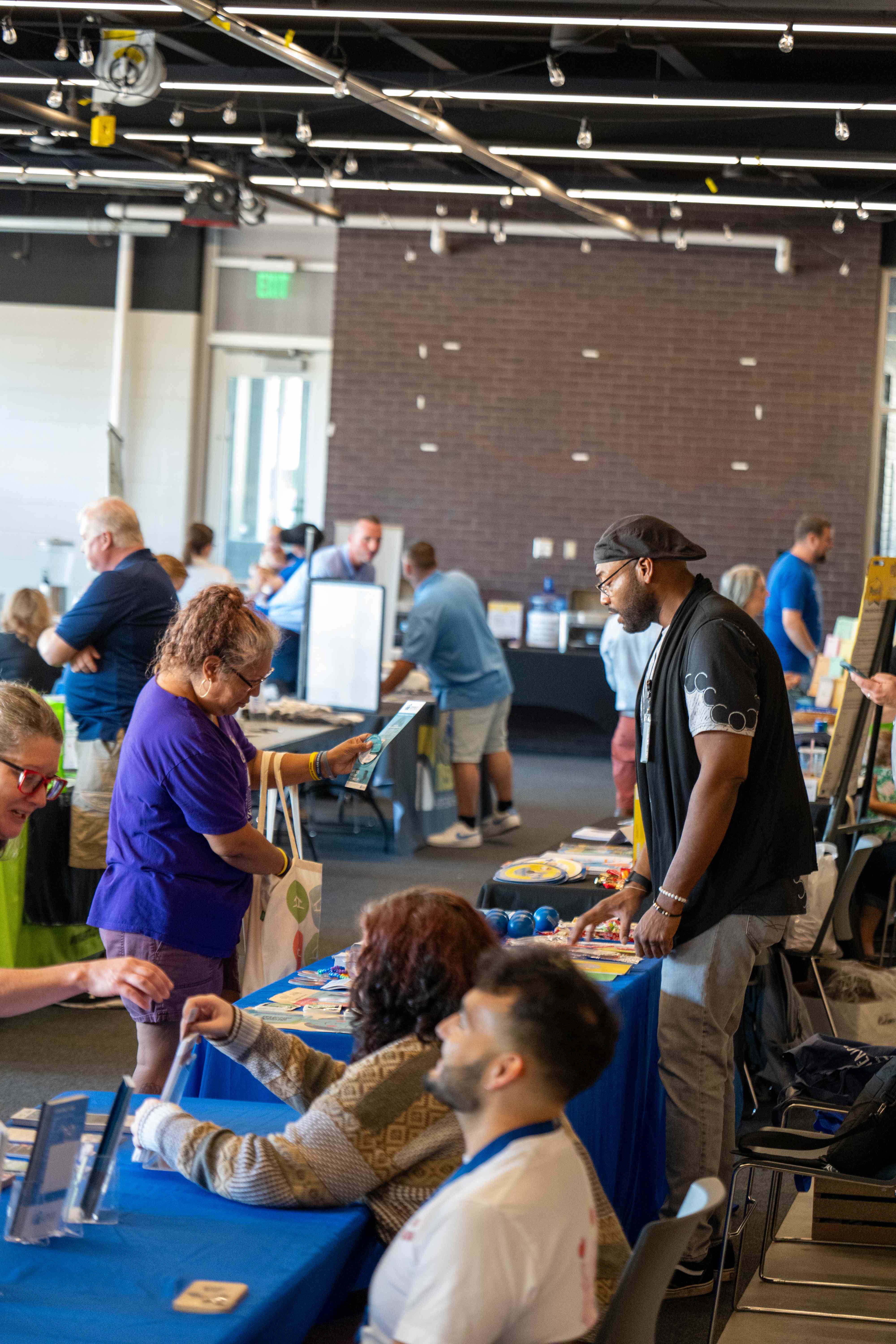 Two attendees networking outside at Recovery Fest